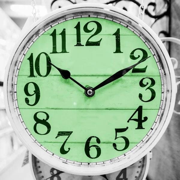 Green clock in a classical style. — Stock Photo, Image