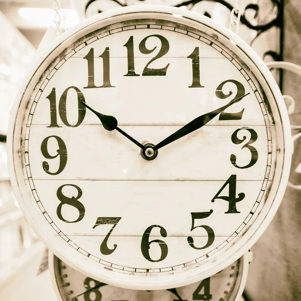 Neutral colored clock in classic style. — Stock Photo, Image