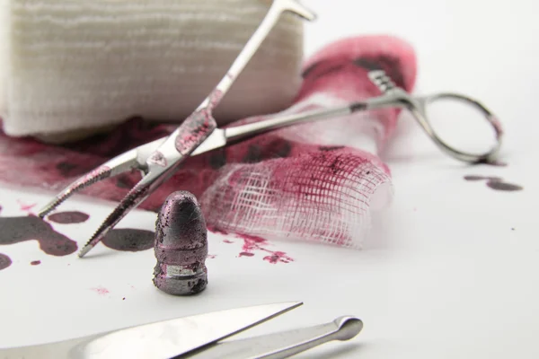Composition with bullet, blood and bandage — Stock Photo, Image