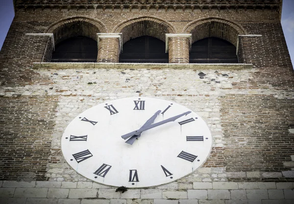 Big white clock on the facade of the bell tower — Stock Photo, Image