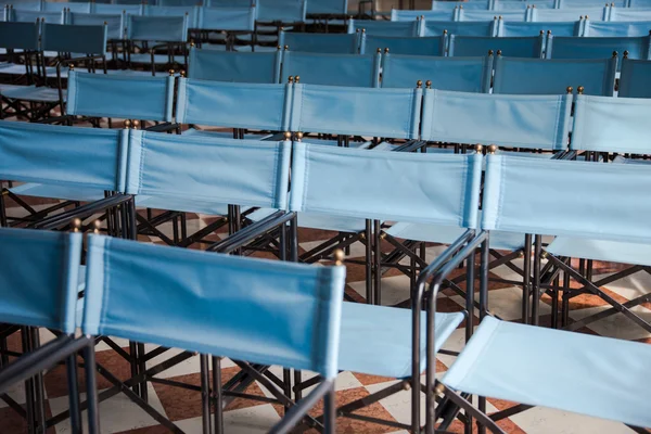 Composition of blue canvas folding chairs — Stock Photo, Image