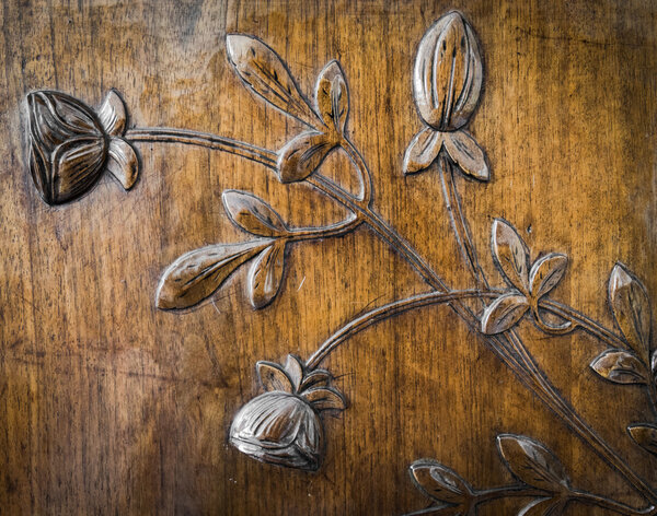 leaves and flowers carved in the wood