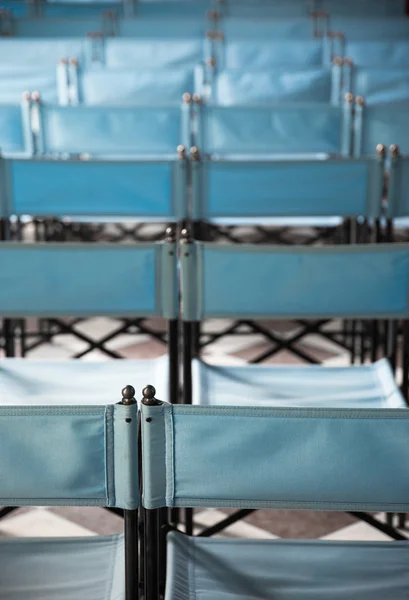 Composition of blue canvas folding chairs — Stock Photo, Image