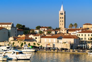 The town of Rab, Croatian tourist resort famous for its bell tow clipart