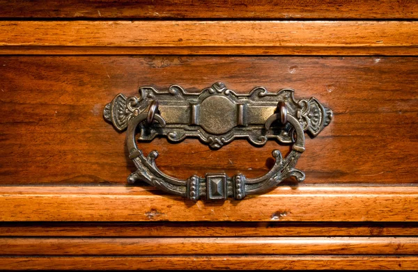 Brass handle hand made of an antique drawer. — Stock Photo, Image