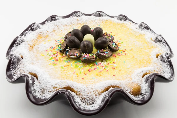 ricotta and chocolate cake decorated with chocolate eggs