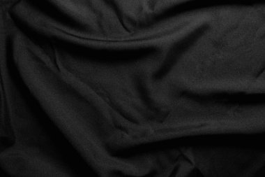 Desen dokusu buruşmuş siyah kumaş arkaplanı