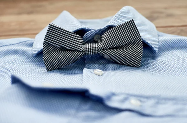 blue shirt with bow tie close-up
