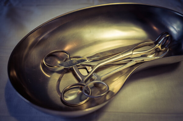 Sterile surgical tray and a set of tools