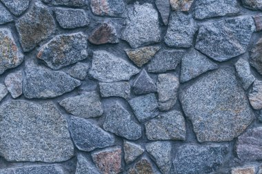 Eski taş işçiliğinin klasik dokusu. Granit Çakıl taşı Duvarı
