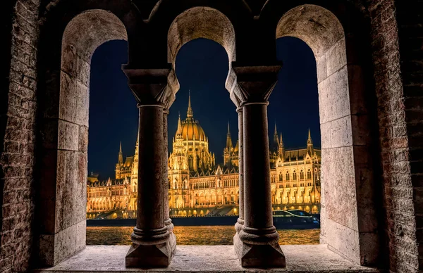 Nice night view from the window. Night panorama of shining Budapest. Elaborately decorated Hungarian parliament building with spectacular lighting. Nigtscape of the ancient european city