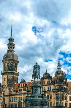 Dresden, Germany - May 02 2019: statue of the Saxon King Johann at the facade of the Semper Opera, and the royal palace-residence, sculptor - Johannes Schilling, installed in 1889 on the Theaterplatz clipart