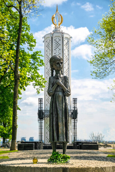 Kyiv, Ukraine - May 14, 2021: sculpture of a girl "Bitter childhood memory",  National Museum of the Holodomor-Genocide in Kyiv, Ukraine, created by the project of the artist Anatoly Gaydamaka
