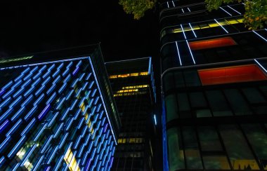 Windows in the modern office building at night. Business concept