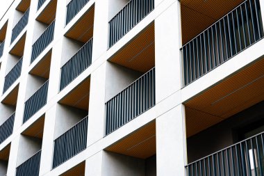 Facade of modern block residential building with balconies