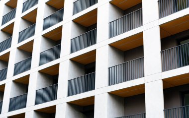 Facade of modern block residential building with balconies