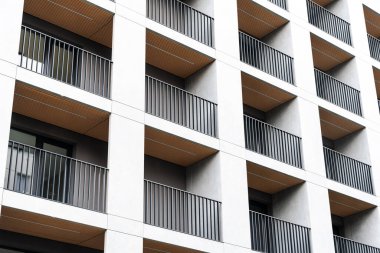 Facade of modern block residential building with balconies