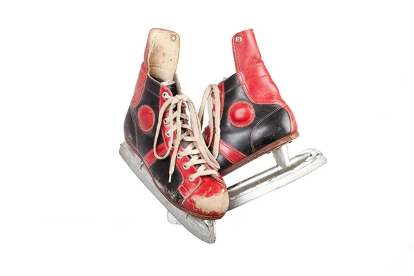 Old ice skates, colored red and black, white background, isolated, retro, vintage — Stock Photo, Image