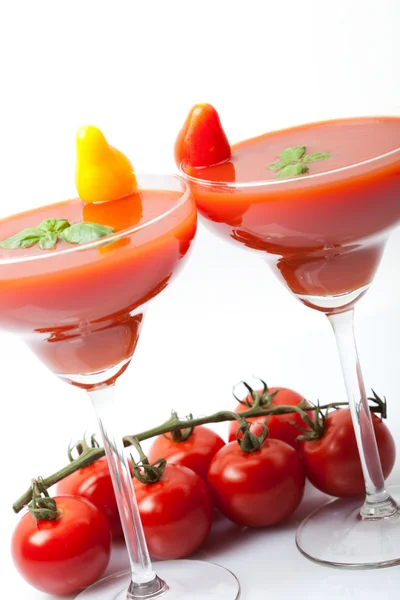 Tomato juice with fresh cocktail tomatoes and basil in glass, white background, isolated, — Stock Photo, Image