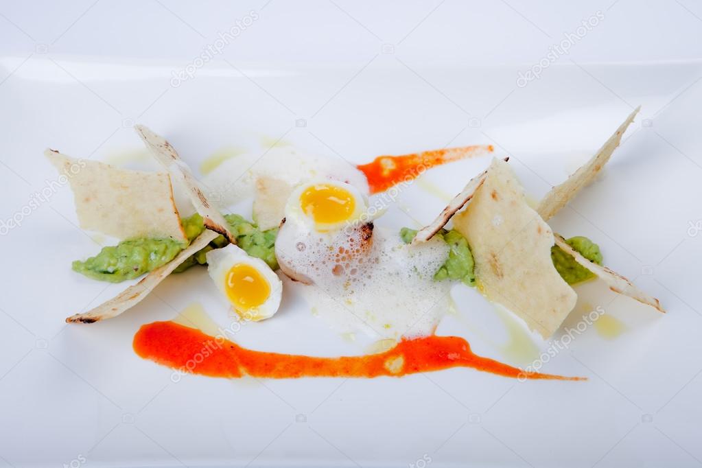 Sea food with fried scallop, quail egg, avocado dip and olive bread,