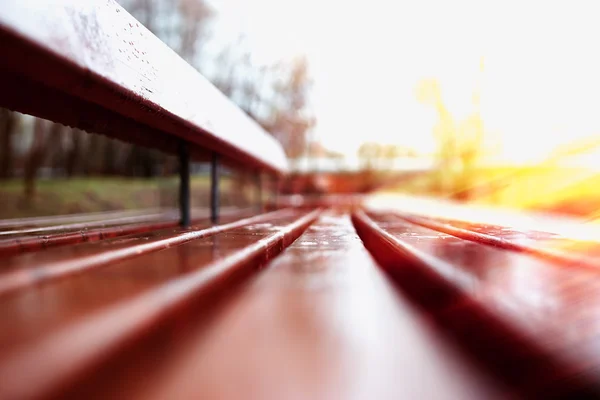 Horizontal bench bokeh with light leak background — Stock Photo, Image