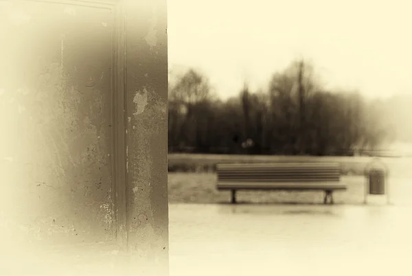 Horizontal vintage sepia bench in park bokeh background — Stock Photo, Image