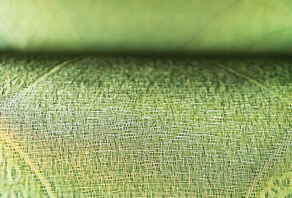 Horizontal tissu vert vif fond bokeh — Photo