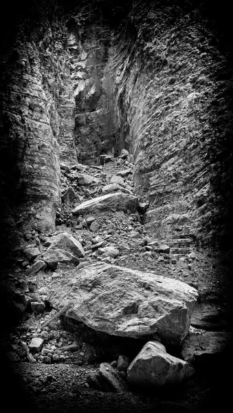 Vertical black and white landslide rock landscape