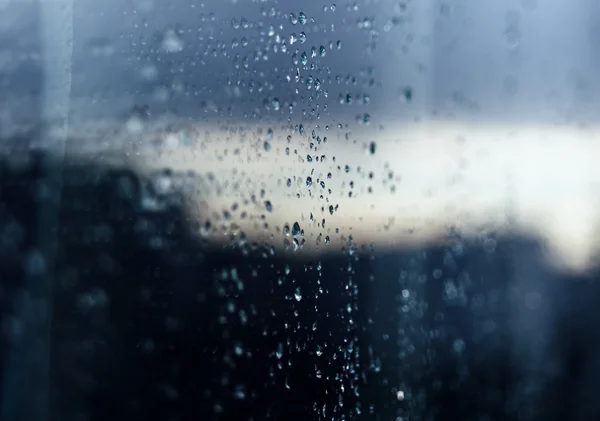 Rain drops on glass reflection — Stock Photo, Image