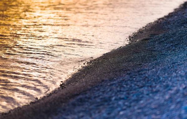Horizontal guijarro playa puesta del sol paisaje bokeh fondo backdr — Foto de Stock
