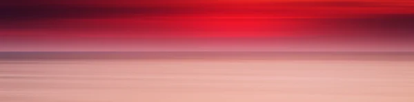 Horizontal large panorama rouge pâle coucher de soleil océan fond de lait b — Photo