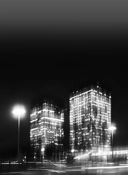 Vertical black and white motion blur skyscraper abstract backdro — Stock Photo, Image