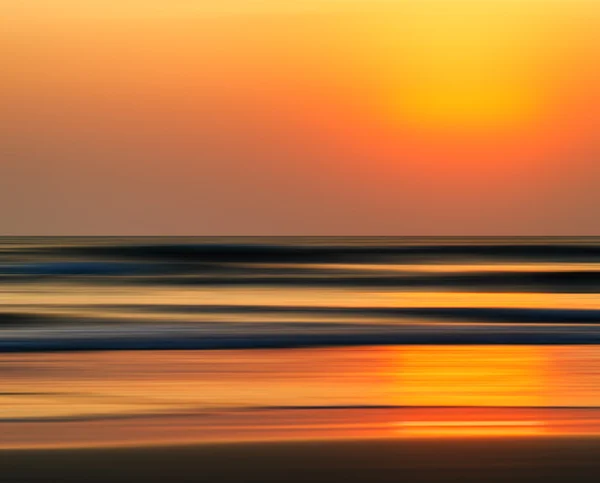 Horizontal vivid orange golden Indian ocean sunset motion abstra