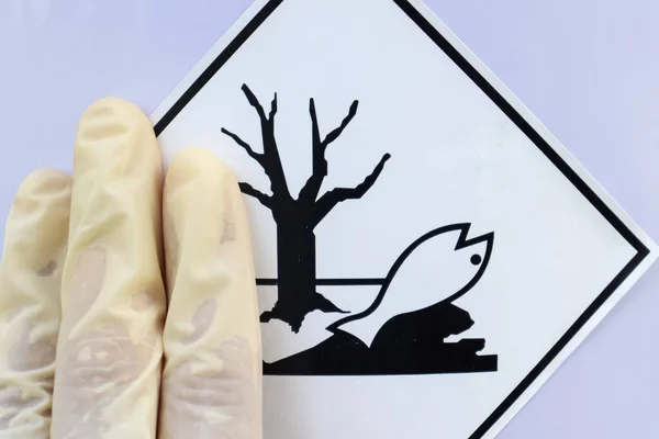 Labeling a sign on a chemical tank