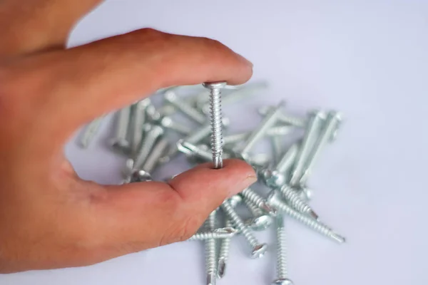 Screws on a white background industrial maintenance equipment