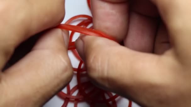 Red Sticky Rubber Band — Stock Video