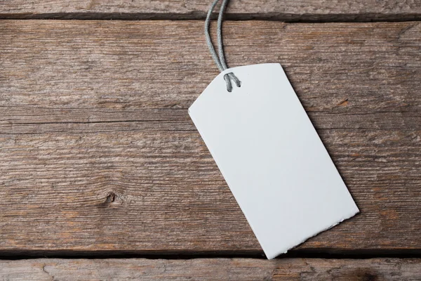 Visit card on wooden table in dark — Stock Photo, Image