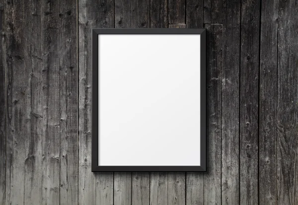 Blank black picture frame on the dark wood texture — Stock Photo, Image