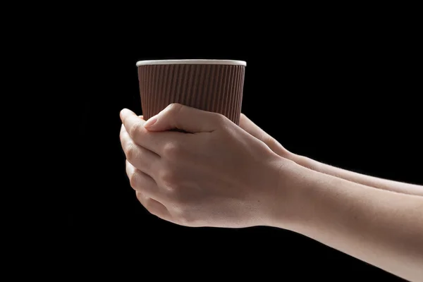 Coffee on hand isolated on black — Stock Photo, Image