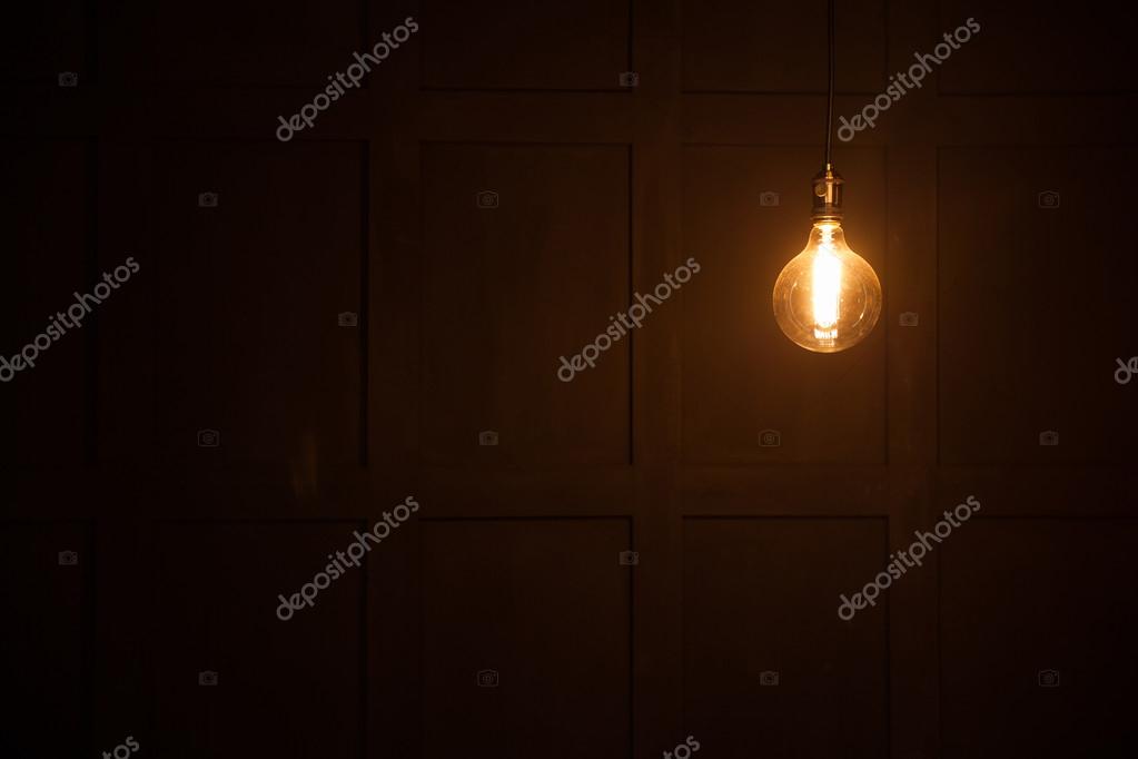 Light bulb on black background — Stock Photo © 4masik 107040770