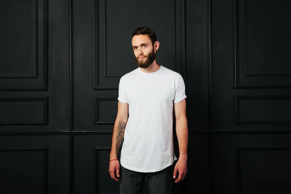 white blank t-shirt with space for your logo on a hipster man wi