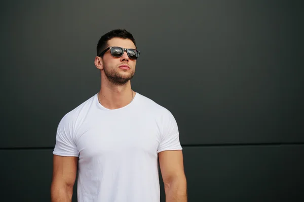 Hipster wearing white blank t-shirt with space for your logo