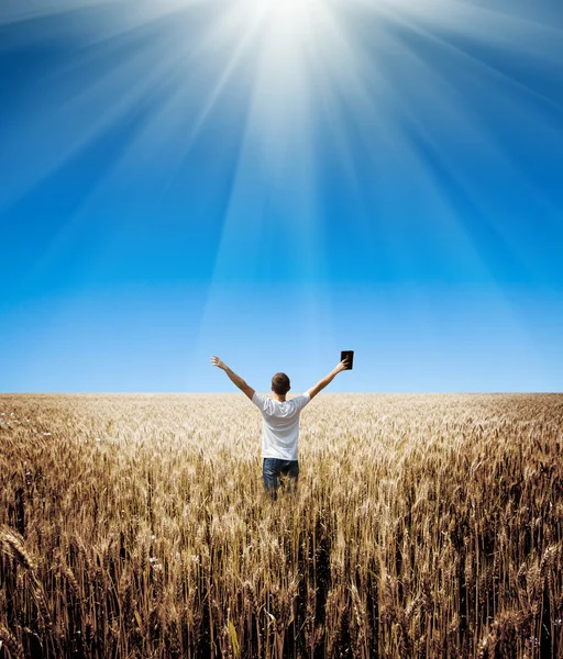 Man holding up Bible — Stock Photo, Image