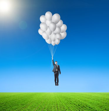 Balonlar çayır ile işadamı