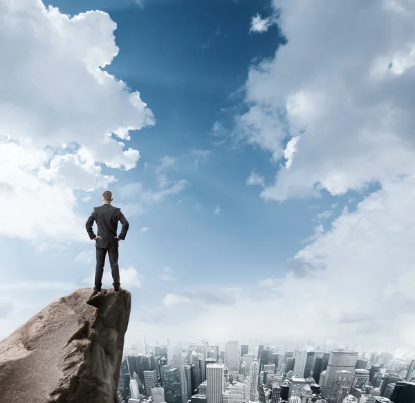 Businessman on mountain top — Stock Photo, Image