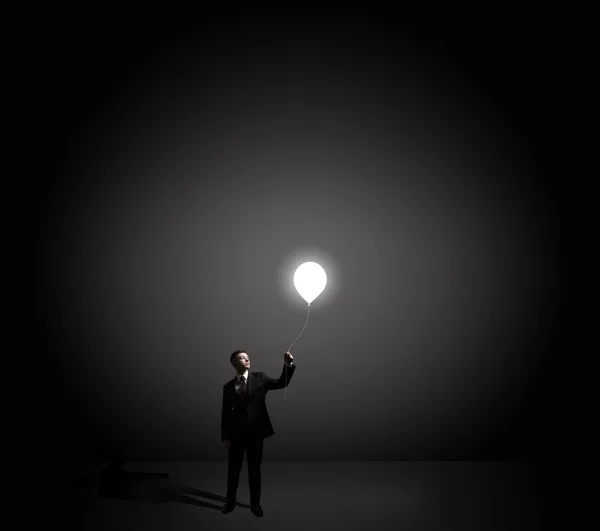 Businessman with idea bulb — Stock Photo, Image