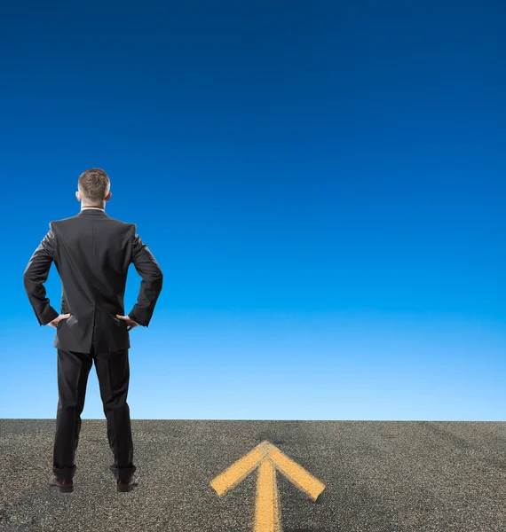 Businessman posing on road — Stock Photo, Image