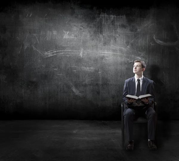 Businessman reading book — Stock Photo, Image