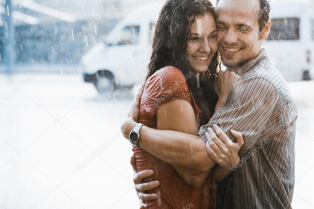 Couple in love under rain