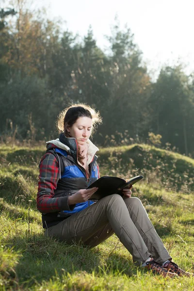 Girl reading holy Bible — Stock Photo, Image